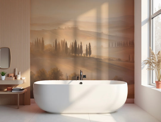 Salle de bain avec baignoire îlot devant un papier peint panoramique de paysage toscan